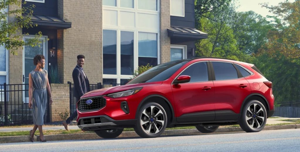 The new Ford Escape sits parked on a city street, showcasing it's eye-catching style and making this SUV a great pick from Johnson City Ford near Kingsport and Bristol.
