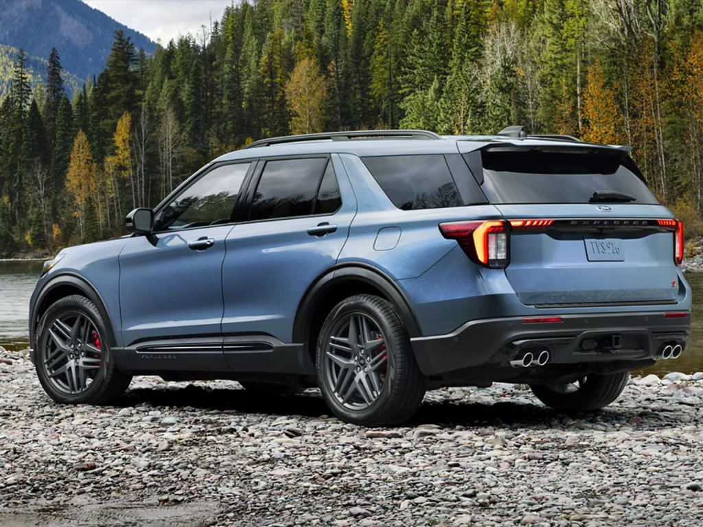 The new blue 2025 Ford Explorer sits parked on a rocky bank next to a river, making this SUV able to go on and off the road seamlessly. Shop for your new Ford Explorer at Johnson City Ford today.